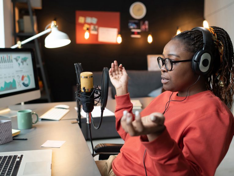 A woman podcasting